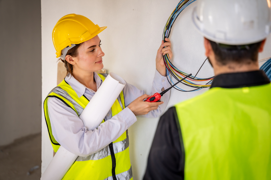 Engineer technician inspects building structures. Engineer technicians are looking at and analyzing unfinished construction projects. In order to be in accordance with the design.